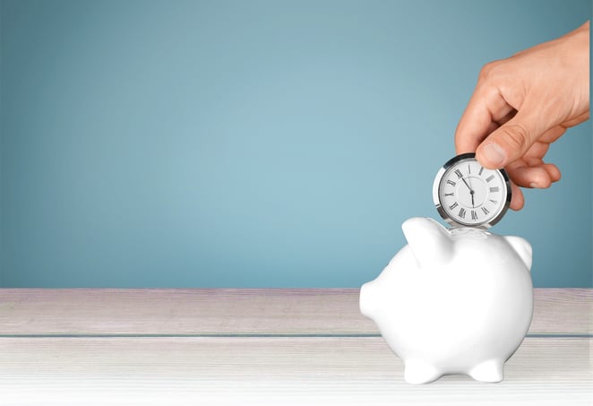 putting clock into a piggy bank