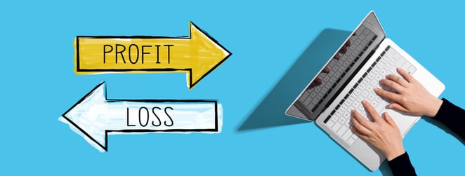 profit and loss drawn next to laptop