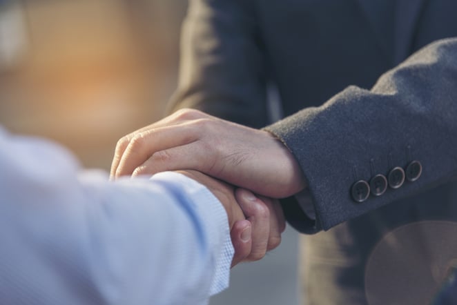handshake in suits